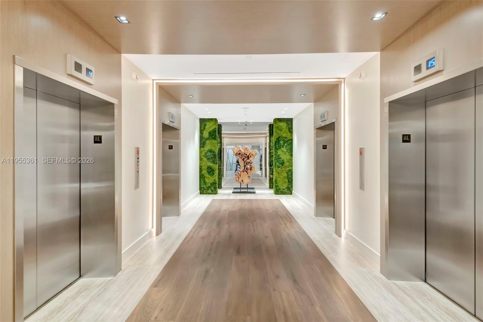 2301 Collins Avenue, Unit 321 Miami Beach, FL 33139 - Photo 5 of 16 a view of hallway with wooden floor