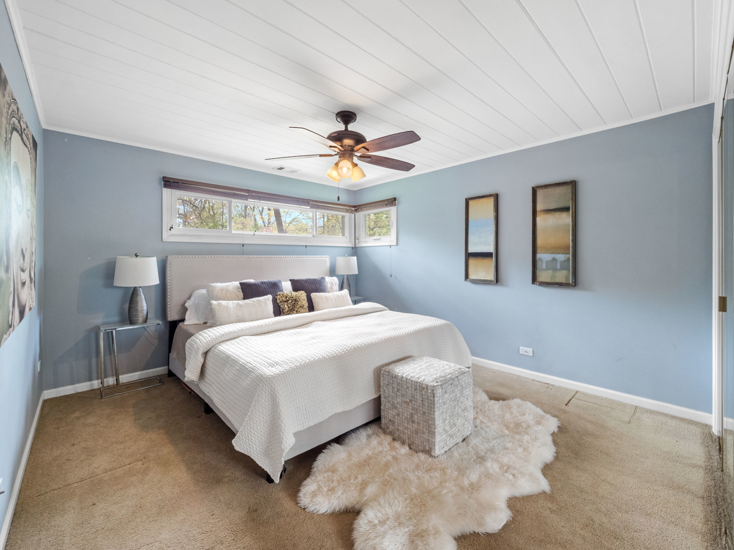 640 Hunter Road Glenview, IL 60025 - Photo 18 of 34 a bedroom with a bed and a ceiling fan