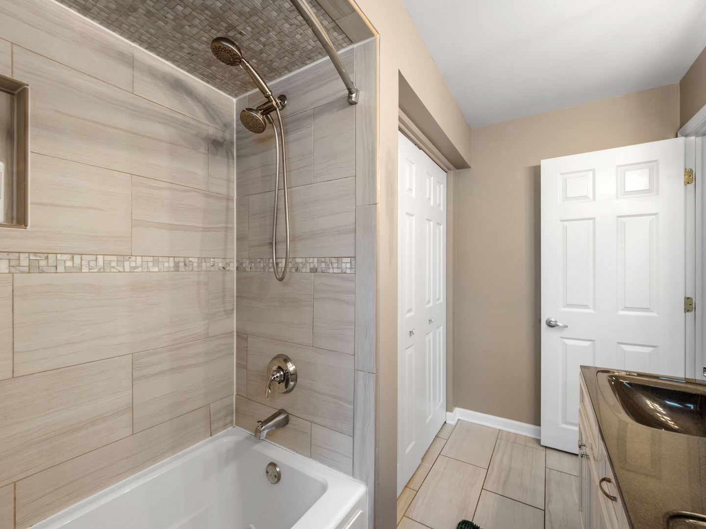 640 Hunter Road Glenview, IL 60025 - Photo 23 of 34 a bathroom with a tub a toilet and a shower