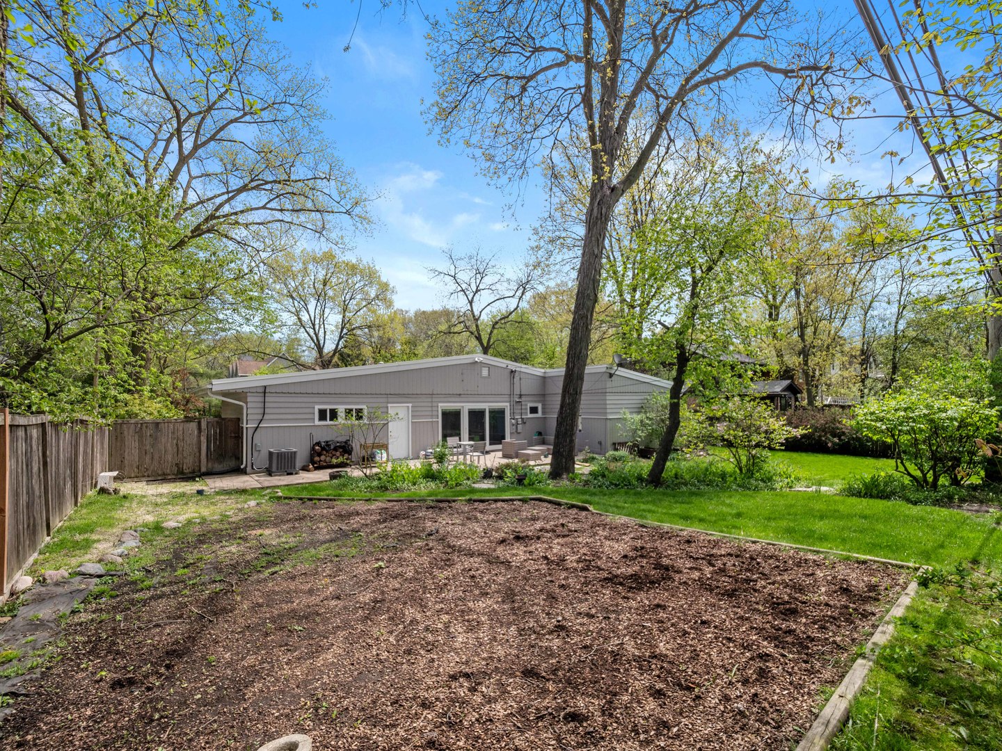 640 Hunter Road Glenview, IL 60025 - Photo 26 of 34 a front view of a house with a yard and trees