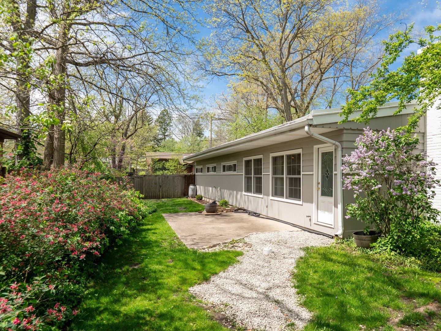 640 Hunter Road Glenview, IL 60025 - Photo 31 of 34 a view of a house with backyard sitting area and garden
