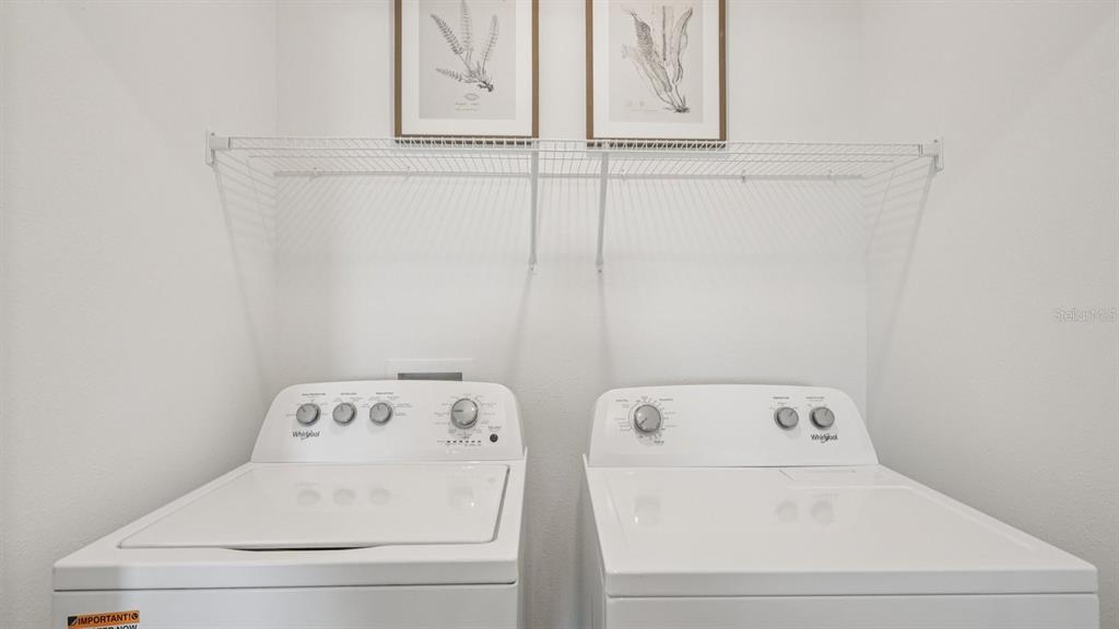 32507 Welling Blade Loop Wesley Chapel, FL 33545 - Photo 29 of 39 a utility room with dryer and washer