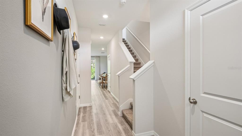 32507 Welling Blade Loop Wesley Chapel, FL 33545 - Photo 5 of 39 a view of entryway with furniture and wooden floor