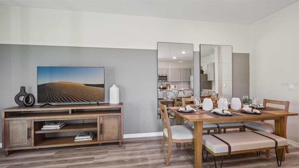 32507 Welling Blade Loop Wesley Chapel, FL 33545 - Photo 9 of 39 a dining room with furniture and wooden floor