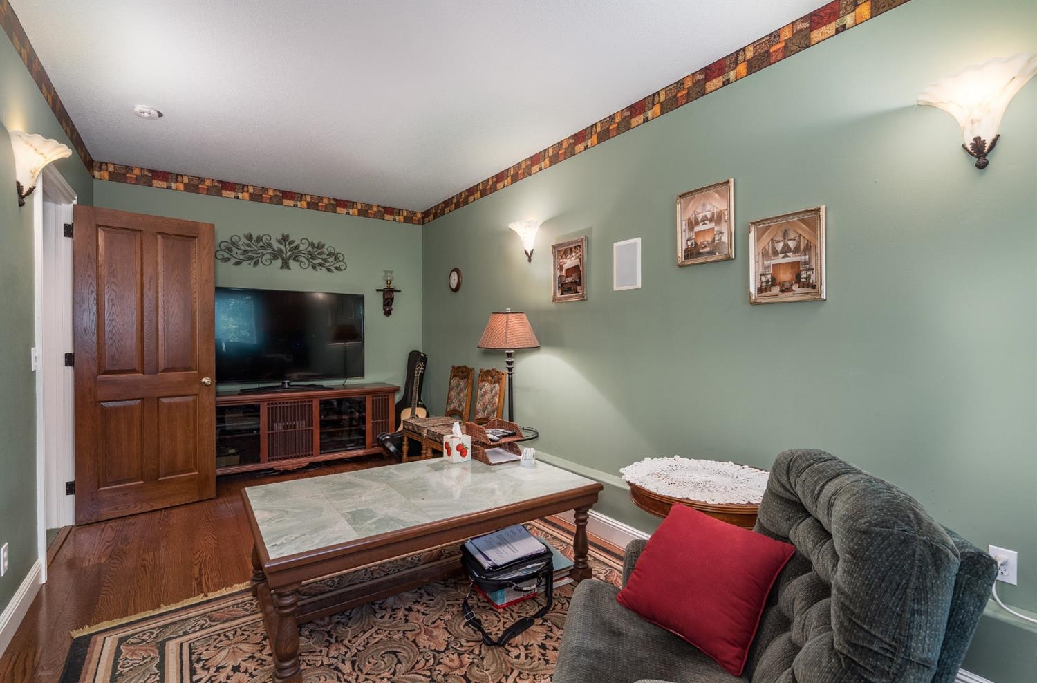 7703 Forest Drive Fish Camp, CA 93623 - Photo 25 of 48 a living room with furniture and a flat screen tv