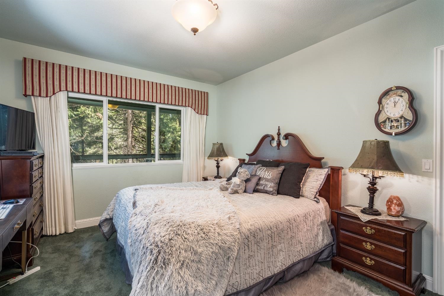 7703 Forest Drive Fish Camp, CA 93623 - Photo 27 of 48 a bedroom with a bed and a window