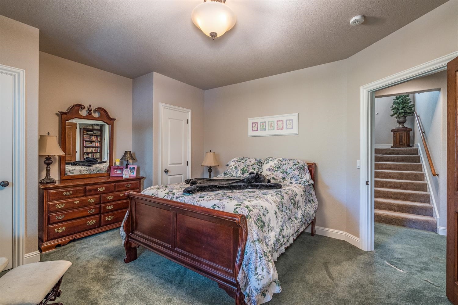 7703 Forest Drive Fish Camp, CA 93623 - Photo 30 of 48 a bedroom with a bed and a dresser