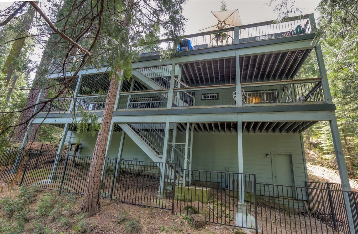 7703 Forest Drive Fish Camp, CA 93623 - Photo 48 of 48 a roof deck with table and chairs