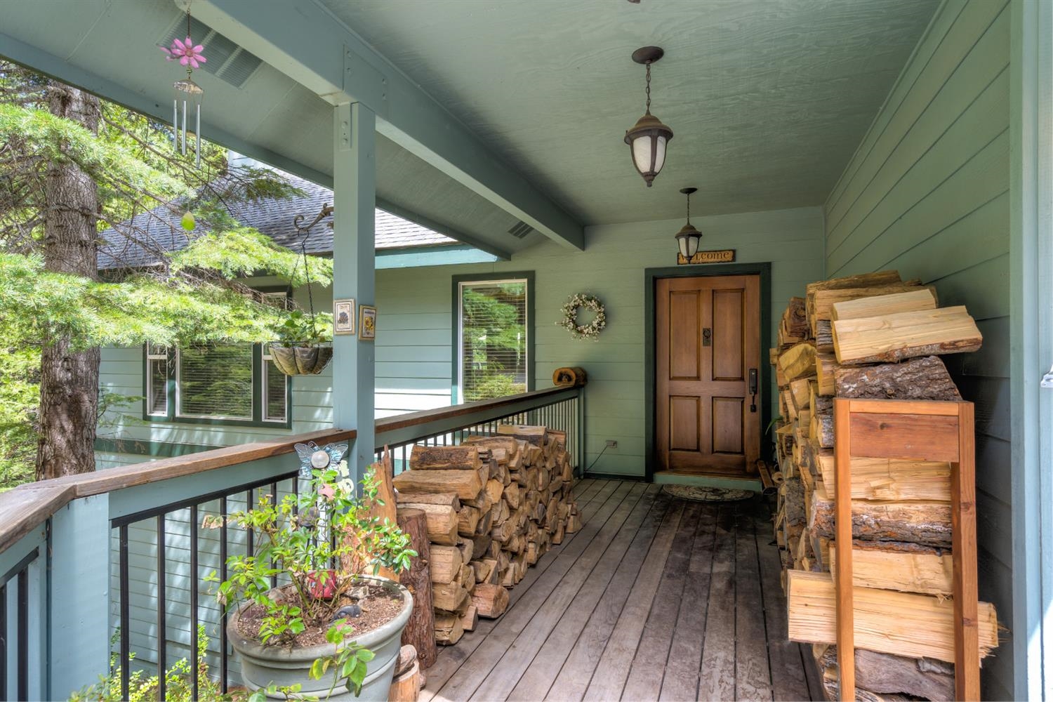 7703 Forest Drive Fish Camp, CA 93623 - Photo 5 of 48 a view of a porch with furniture