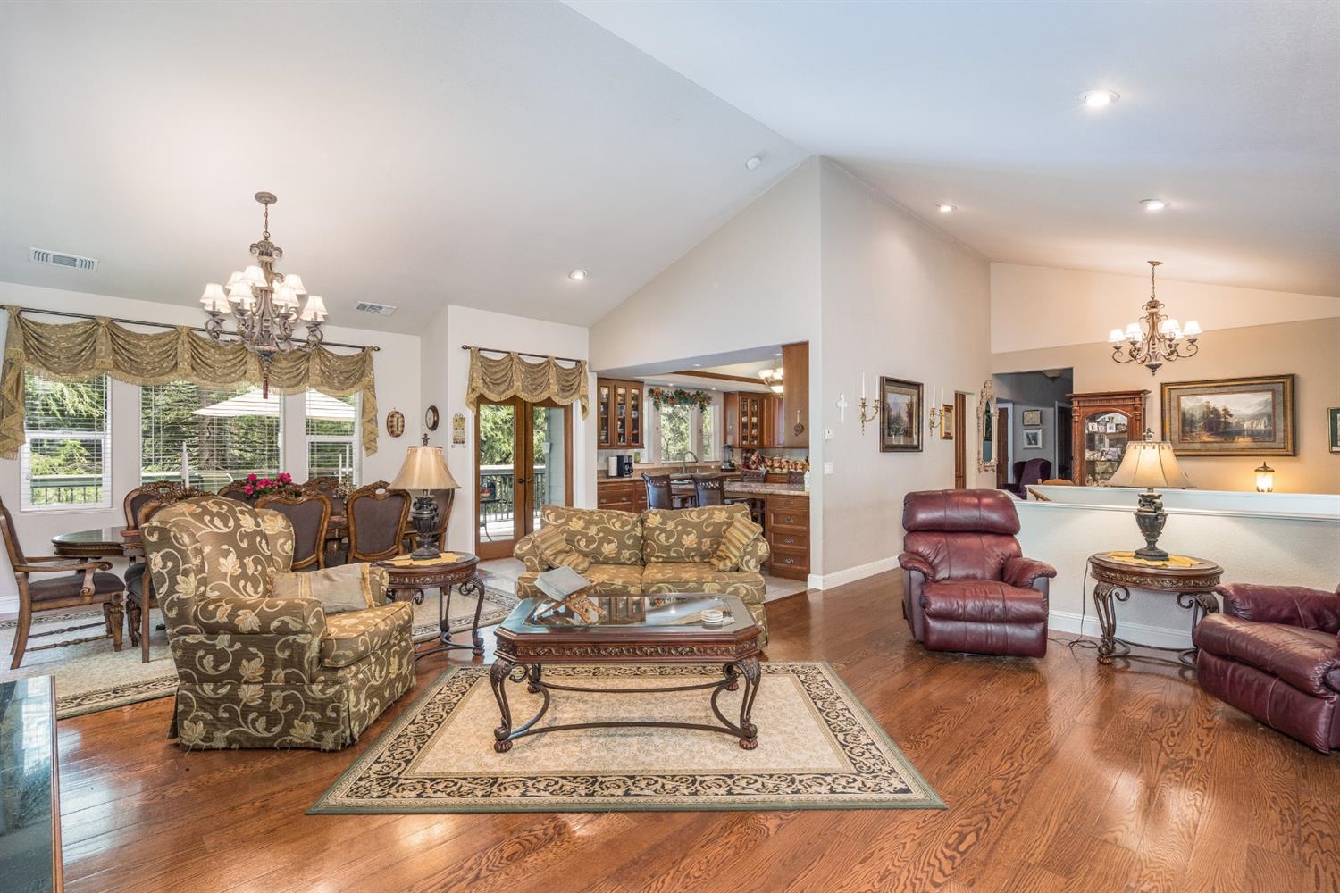 7703 Forest Drive Fish Camp, CA 93623 - Photo 10 of 48 a living room with furniture and a chandelier