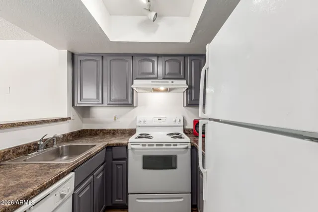 a kitchen with a stove and a sink