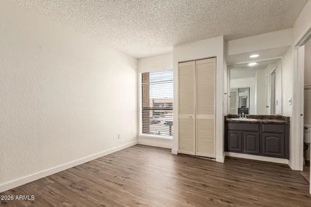 an empty room with wooden floor