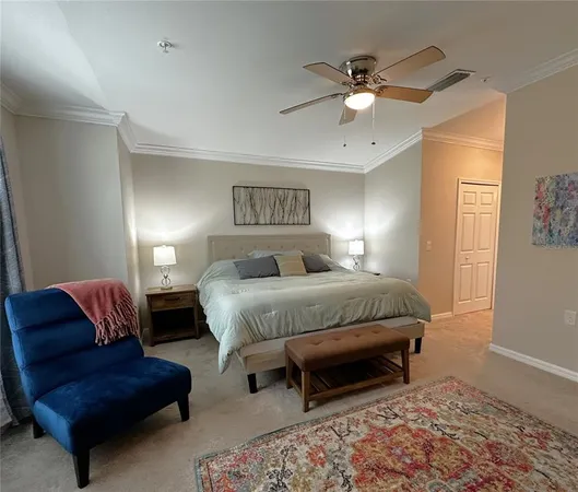 a spacious bedroom with a bed and a couch