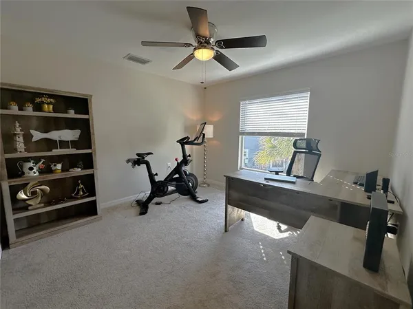 a view of a workspace with furniture