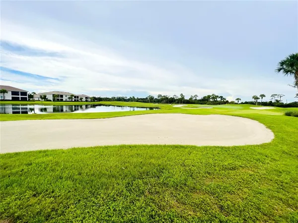 a view of a lake with a big yard