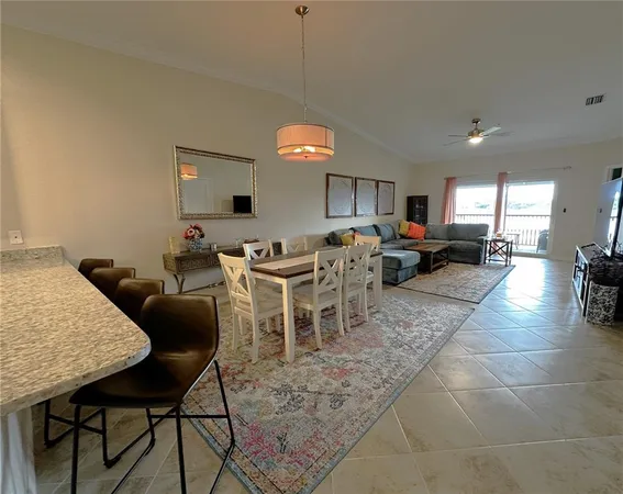 a living room with lots of furniture and a chandelier
