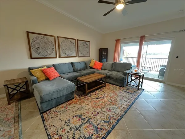 a living room with furniture and a rug