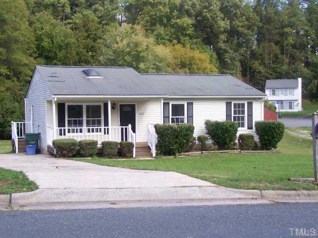 1922 Strebor Street Durham, NC 27705 - Photo 1 of 4 a house that has a tree in front of it