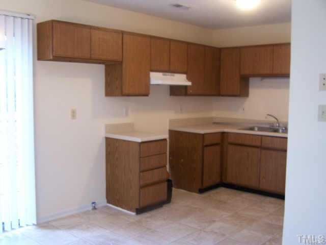 1922 Strebor Street Durham, NC 27705 - Photo 2 of 4 a kitchen with a sink and cabinets