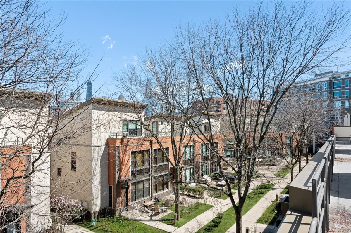 930 North Howe Street Chicago, IL 60610 - Photo 21 of 27 a view of a house with a yard