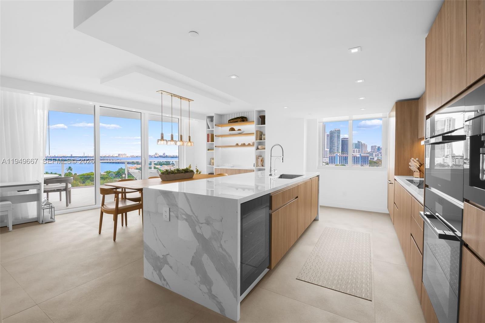 a large kitchen with stainless steel appliances lots of counter top space