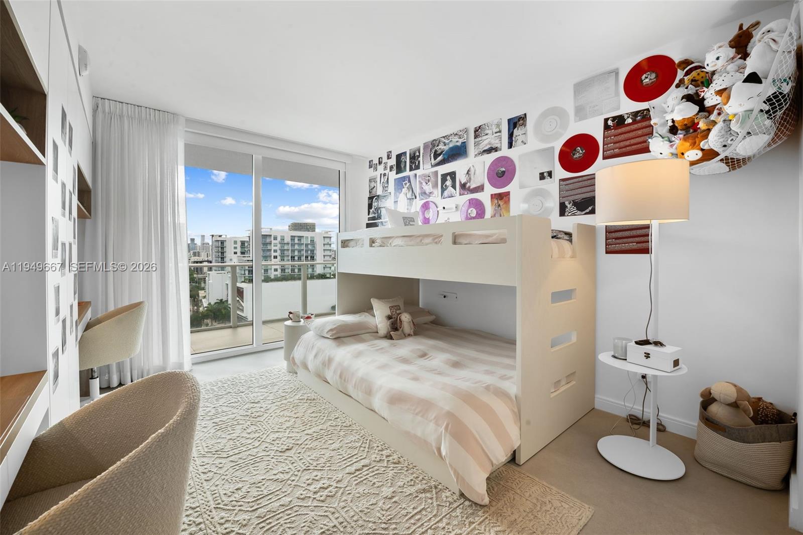 4250 Biscayne Boulevard, Unit 1201 Miami, FL 33137 - Photo 11 of 41 a living room with furniture and a table