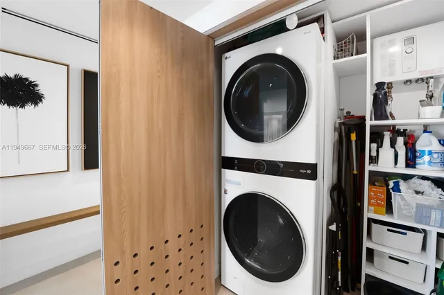 a view of a hallway with washer and dryer