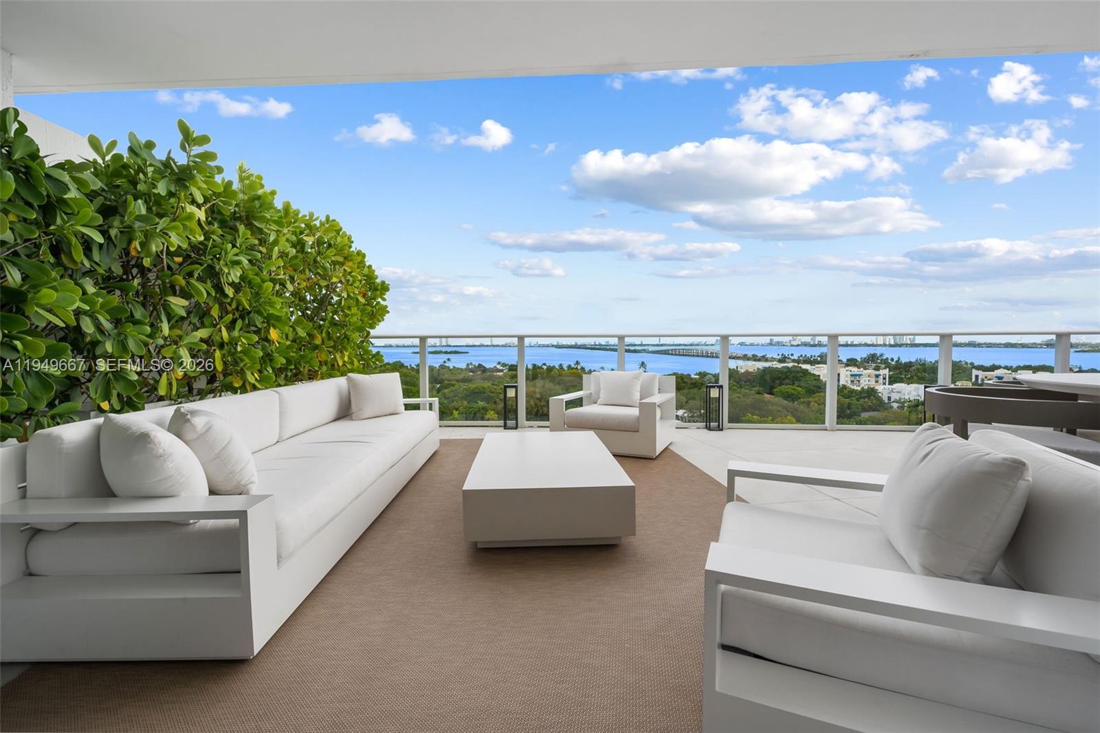 4250 Biscayne Boulevard, Unit 1201 Miami, FL 33137 - Photo 22 of 41 a roof deck with couches and potted plants