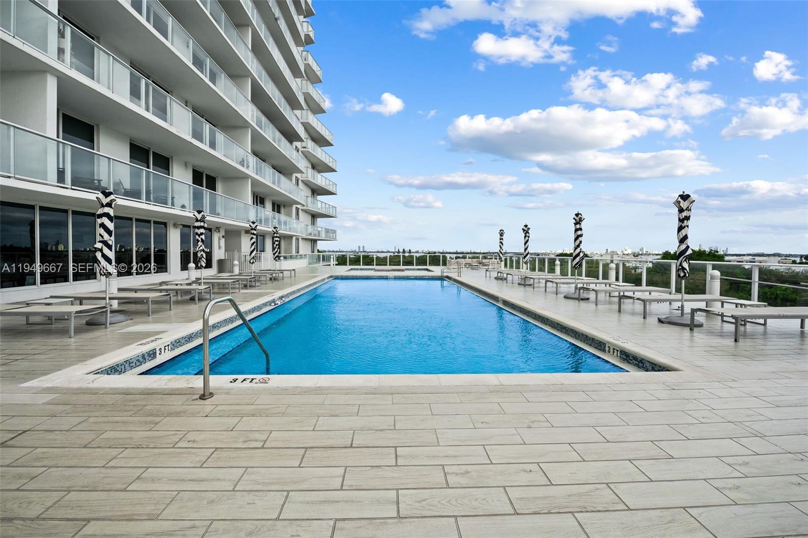 4250 Biscayne Boulevard, Unit 1201 Miami, FL 33137 - Photo 27 of 41 a view of a swimming pool with outdoor seating