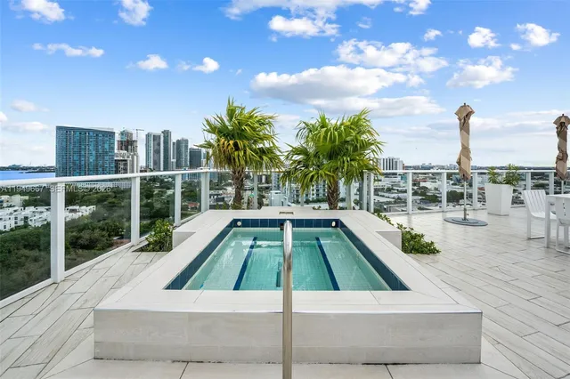 a view of a swimming pool with a lounge chair