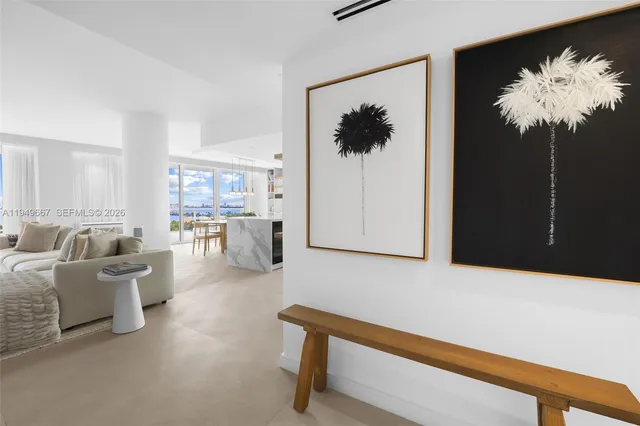 a large kitchen with stainless steel appliances a large counter top a stove top oven and cabinets