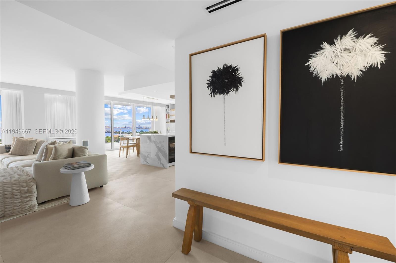 4250 Biscayne Boulevard, Unit 1201 Miami, FL 33137 - Photo 37 of 41 a living room with furniture a chandelier and a window