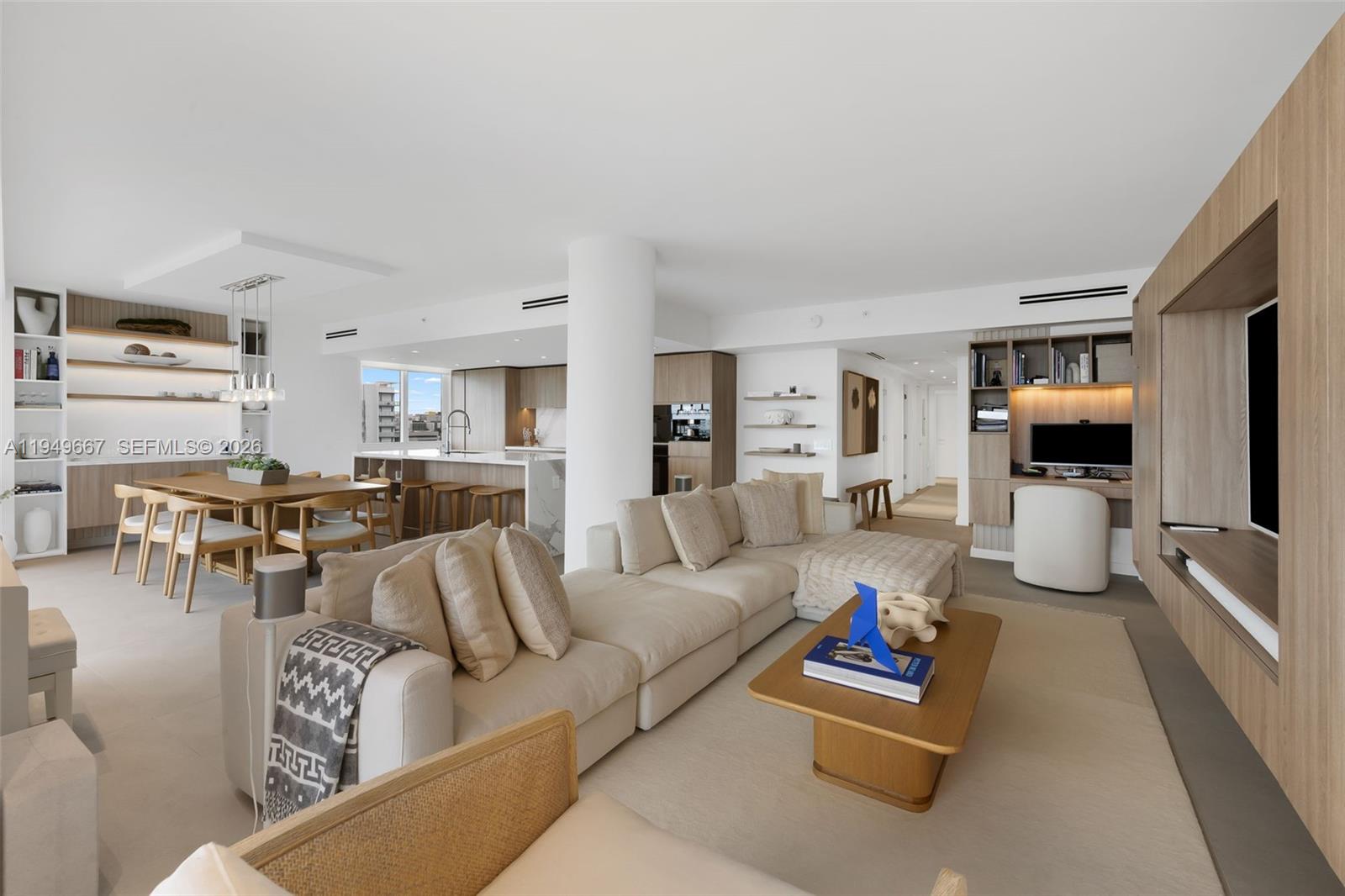 4250 Biscayne Boulevard, Unit 1201 Miami, FL 33137 - Photo 4 of 41 a living room with furniture and a flat screen tv