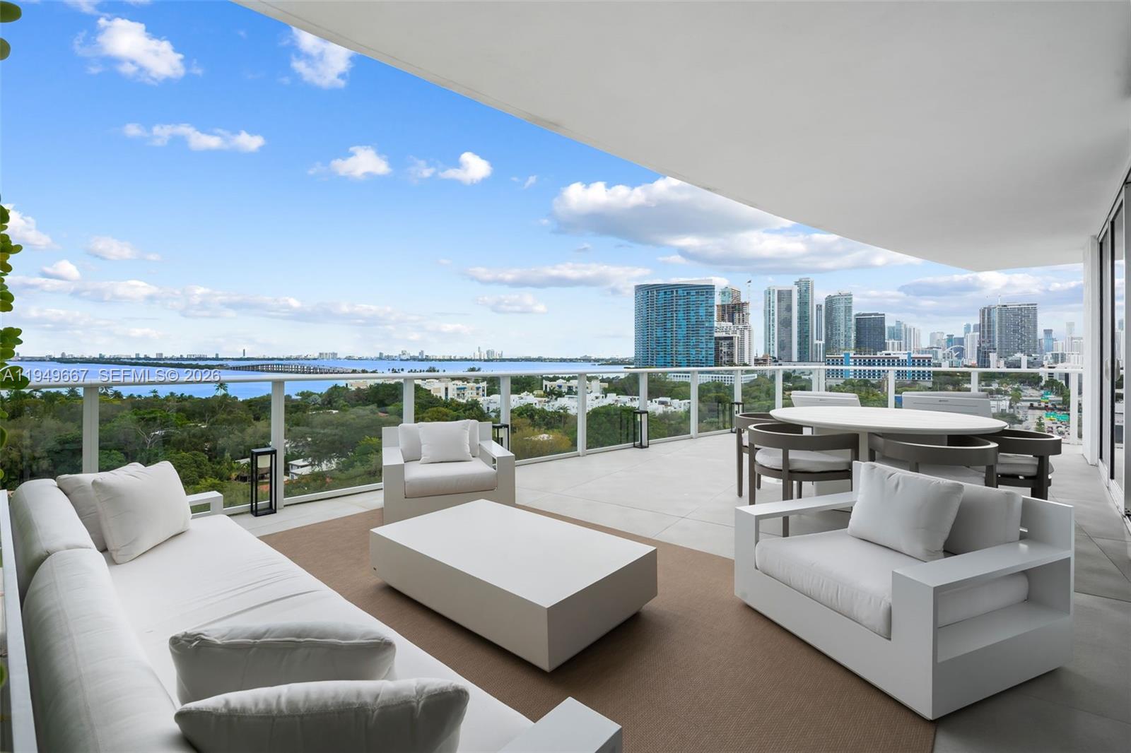 4250 Biscayne Boulevard, Unit 1201 Miami, FL 33137 - Photo 5 of 41 a living room with furniture and a view of kitchen