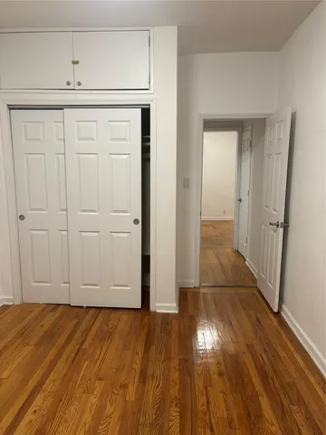 a view of hallway with wooden floor