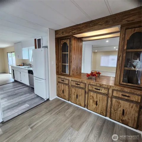 a kitchen with stainless steel appliances a sink and a refrigerator