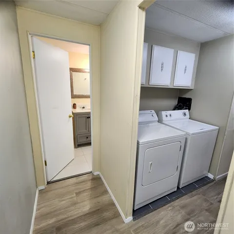 a view of storage and utility room with washer and dryer