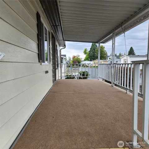 a view of balcony with furniture