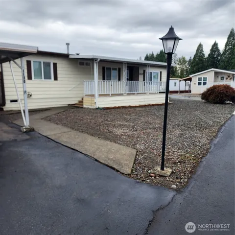 a front view of a house with garage
