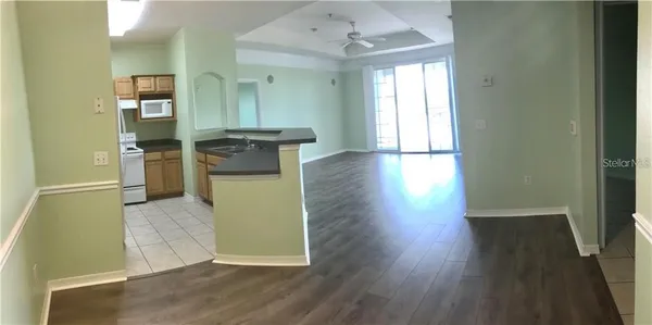 a view of a kitchen cabinets and wooden floor