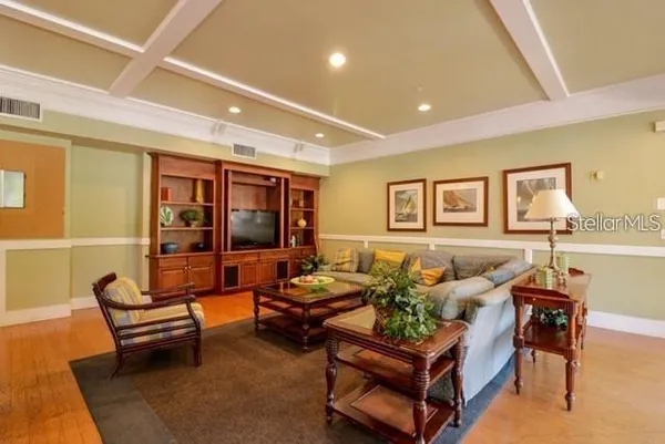 a living room with furniture and next to a window