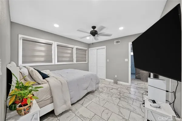 a large kitchen with kitchen island a sink table and chairs