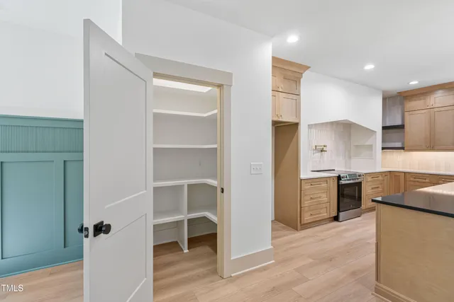 a kitchen with a refrigerator and a sink