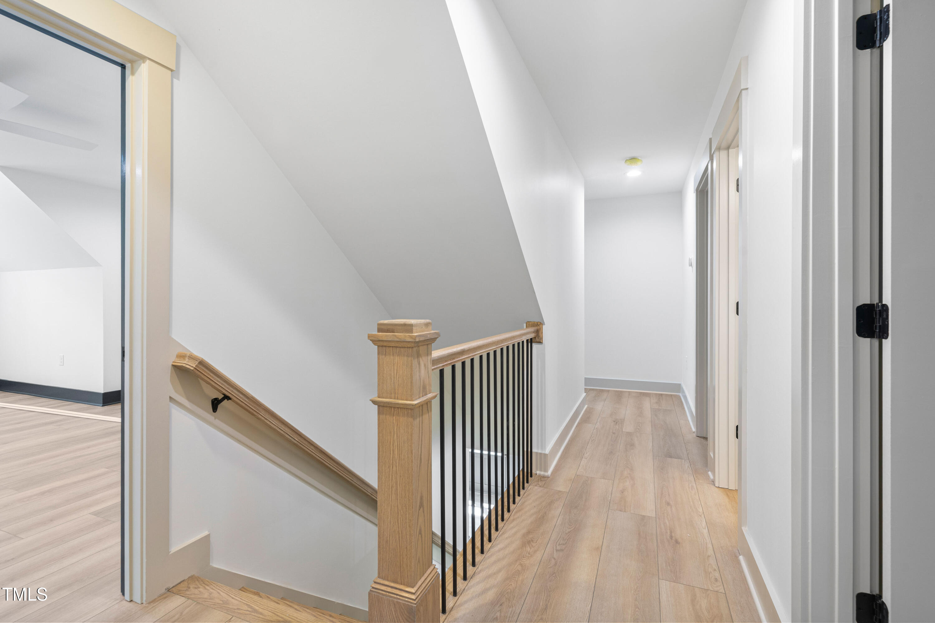 312 Russ Road Smithfield, NC 27577 - Photo 26 of 60 a view of a hallway with wooden floor and entryway