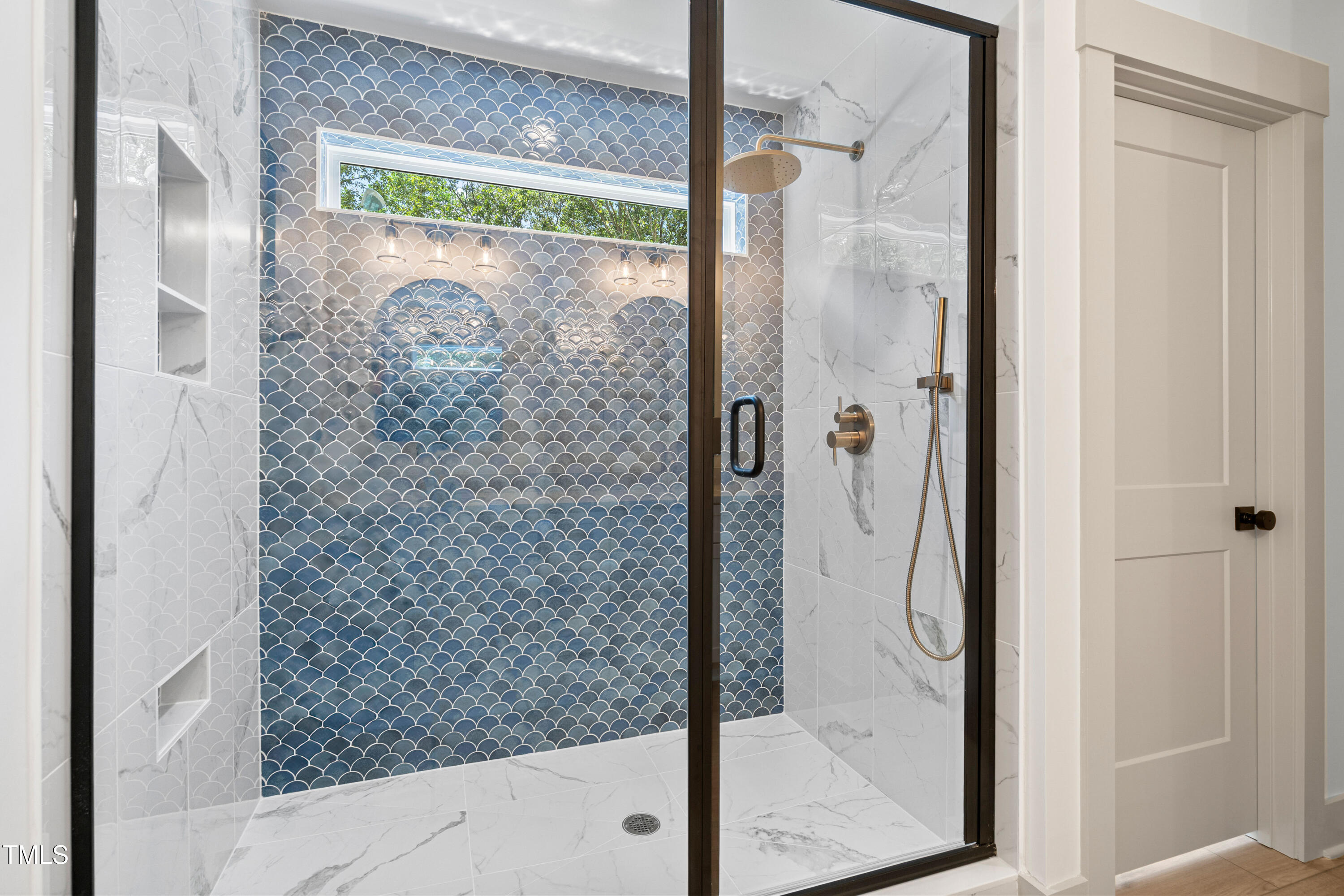 312 Russ Road Smithfield, NC 27577 - Photo 31 of 60 a bathroom with a glass shower door