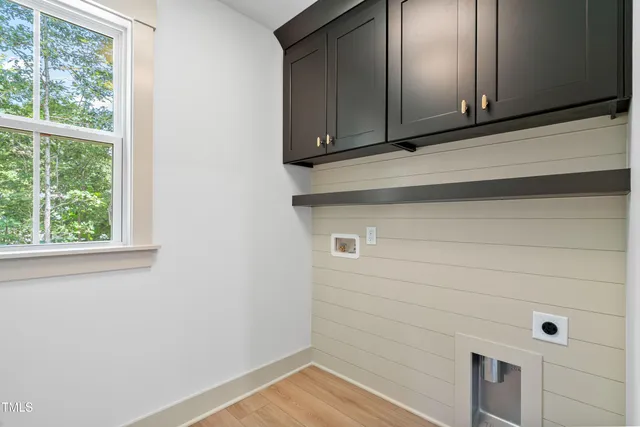 a bathroom with a double vanity sink toilet and shower