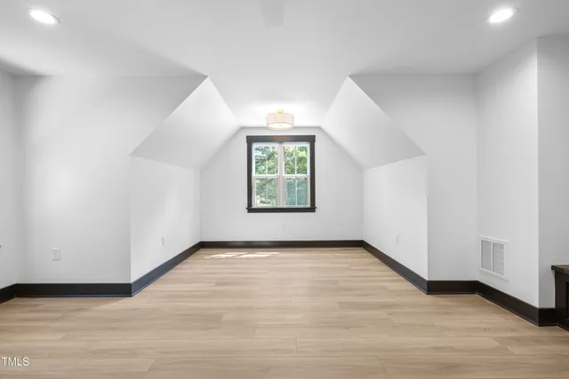 a view of empty room with a ceiling fan and window