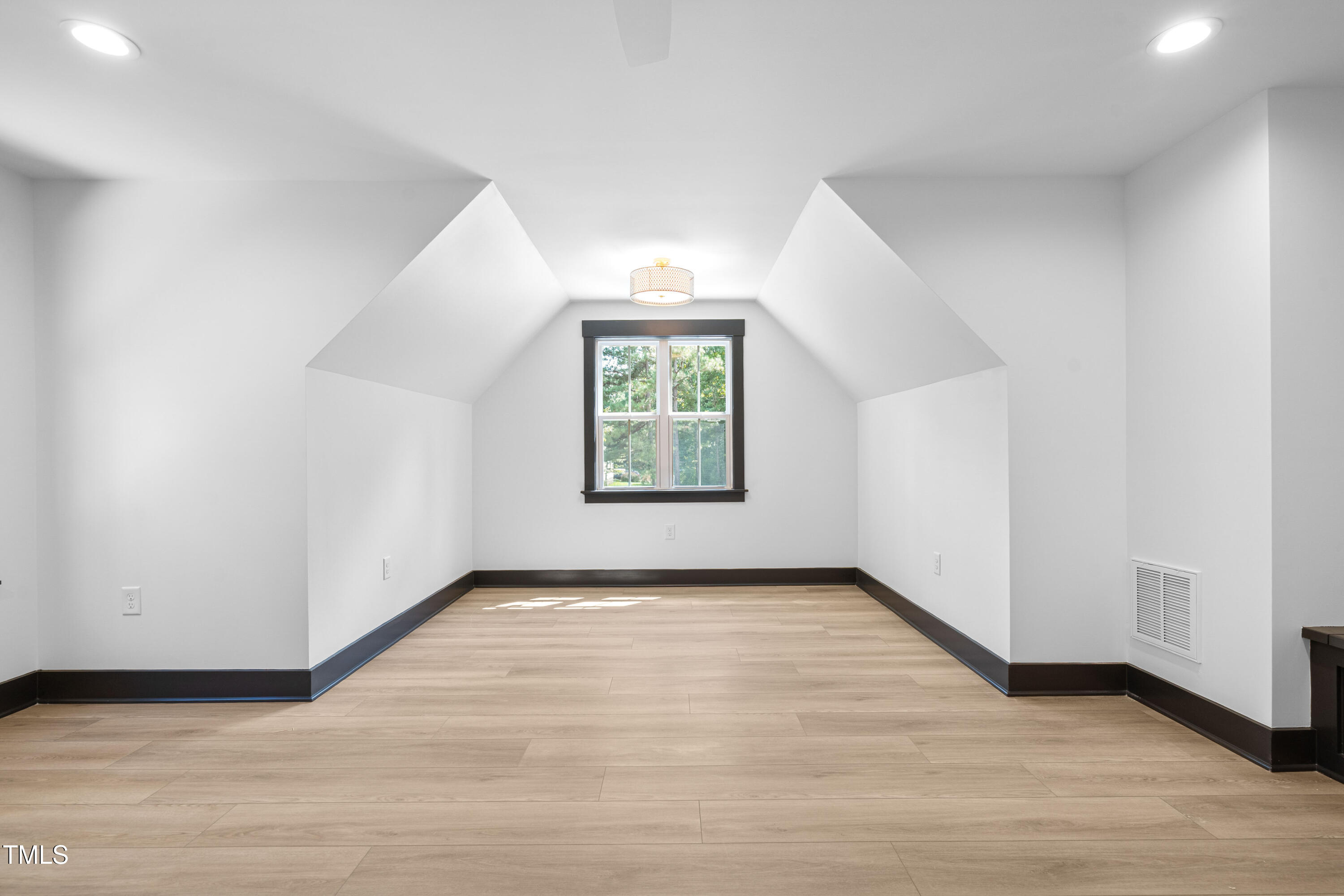 312 Russ Road Smithfield, NC 27577 - Photo 40 of 60 an empty room with windows & cabinet