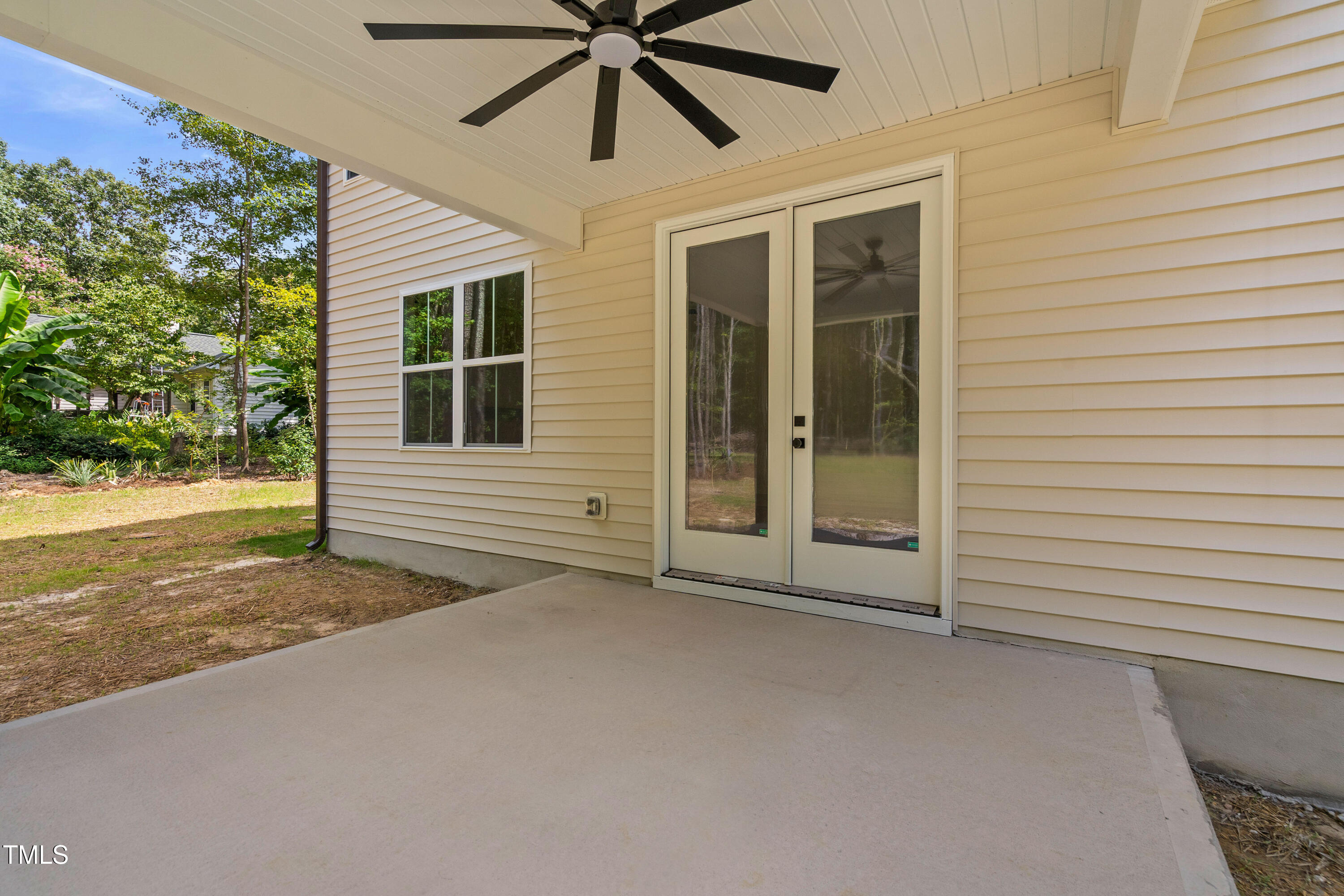 312 Russ Road Smithfield, NC 27577 - Photo 46 of 60 a view of a livingroom with a ceiling fan and window