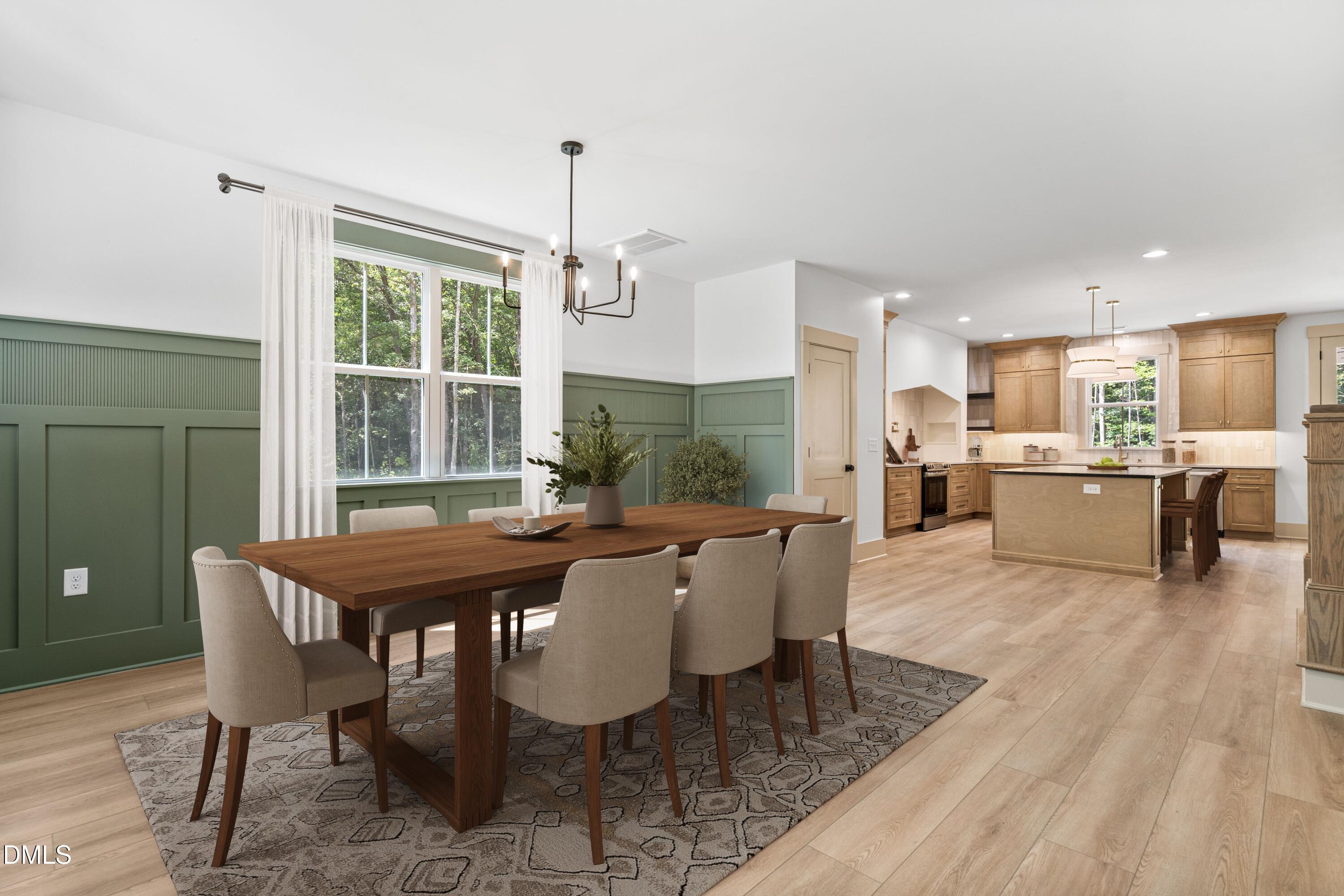 312 Russ Road Smithfield, NC 27577 - Photo 5 of 60 a view of a dining room with furniture window and wooden floor